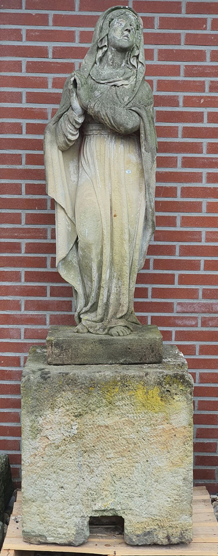 Sandstone statue of the Virgin on a pedestal