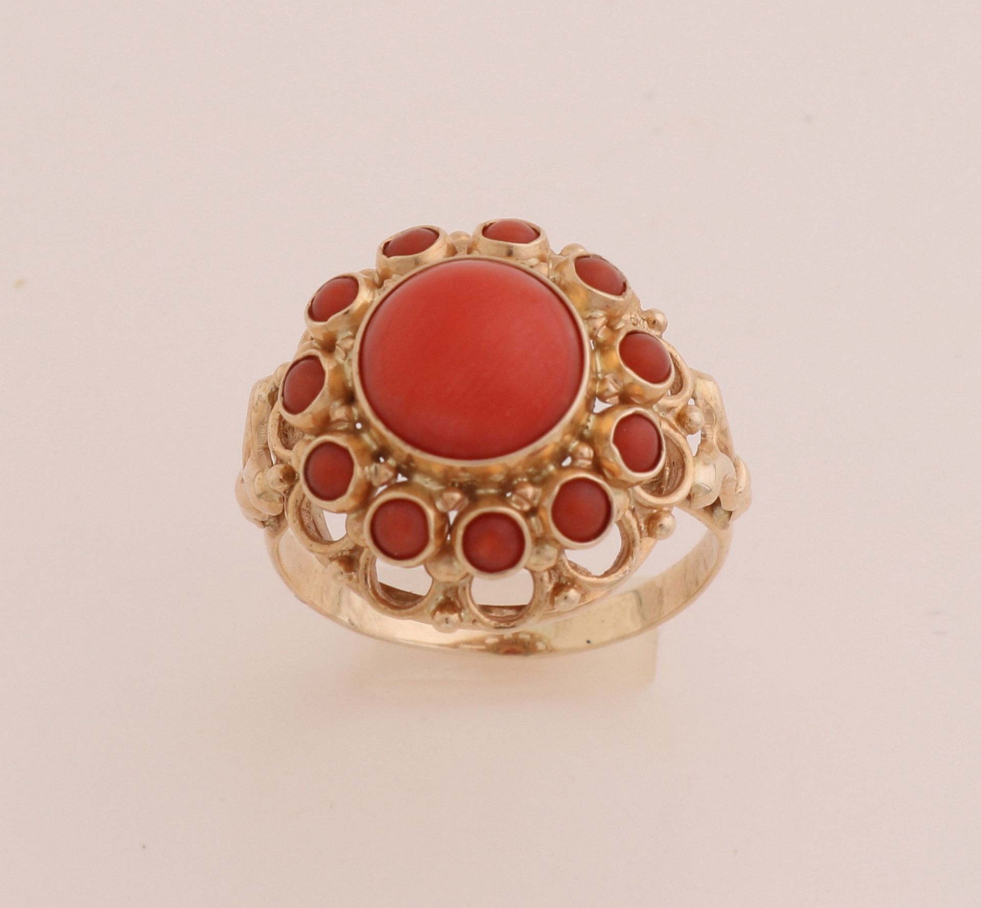 Gold ring with red coral