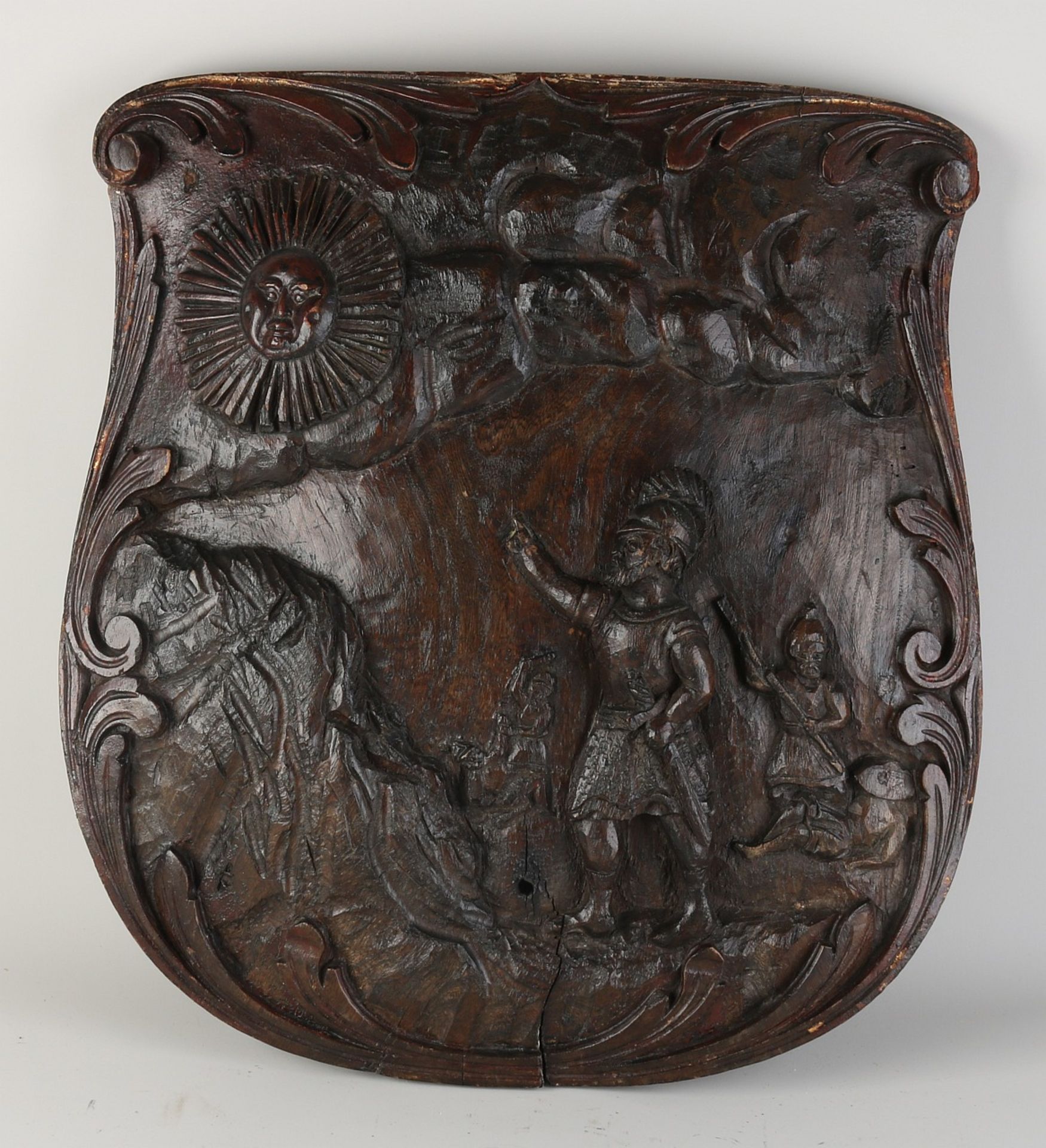 Carved shield with representation