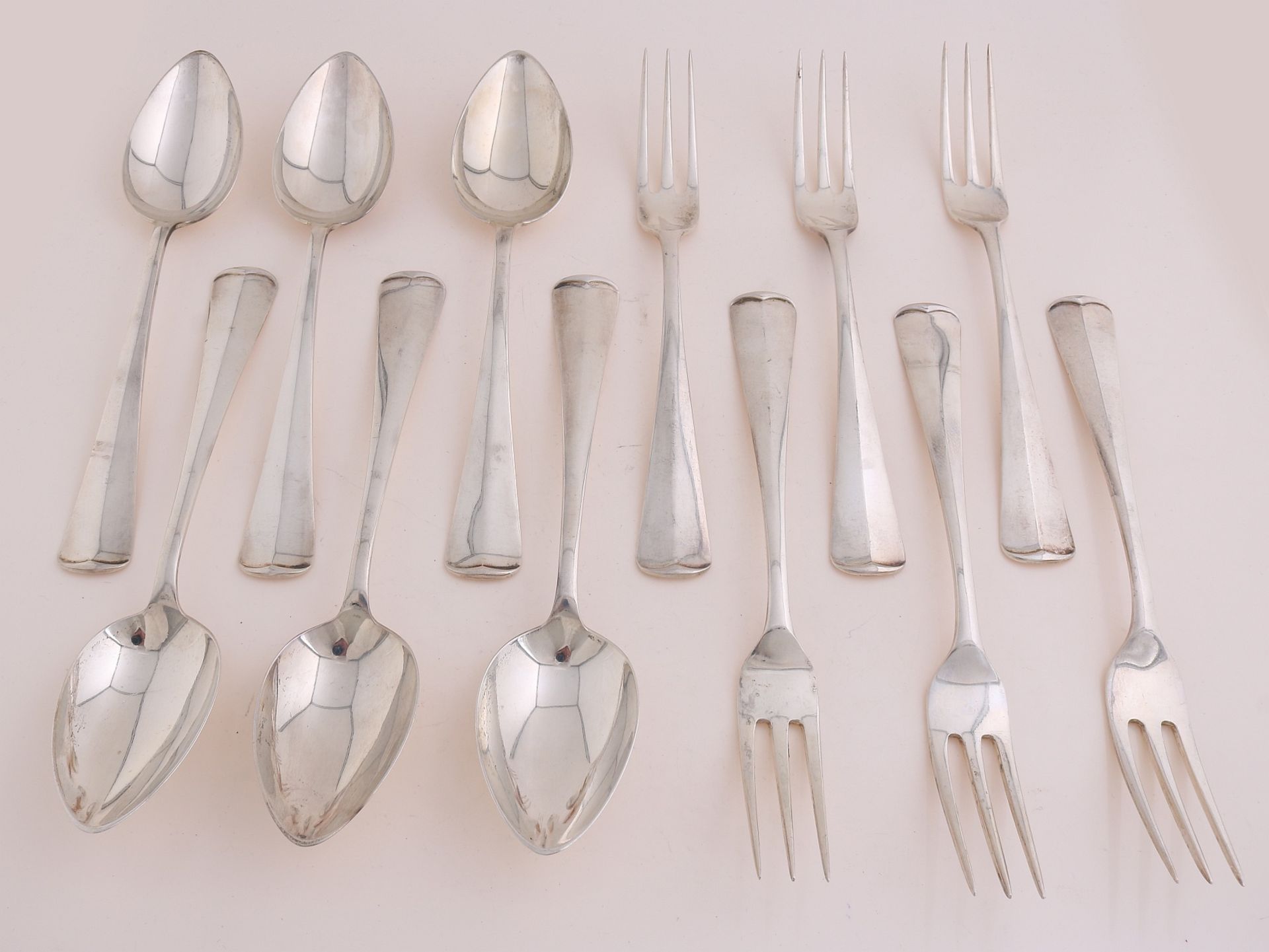 6 silver spoons and 6 forks