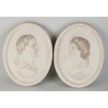 Two marble wall plaques