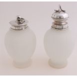 Two tea canisters with silver caps