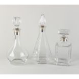 3 decanters with silver