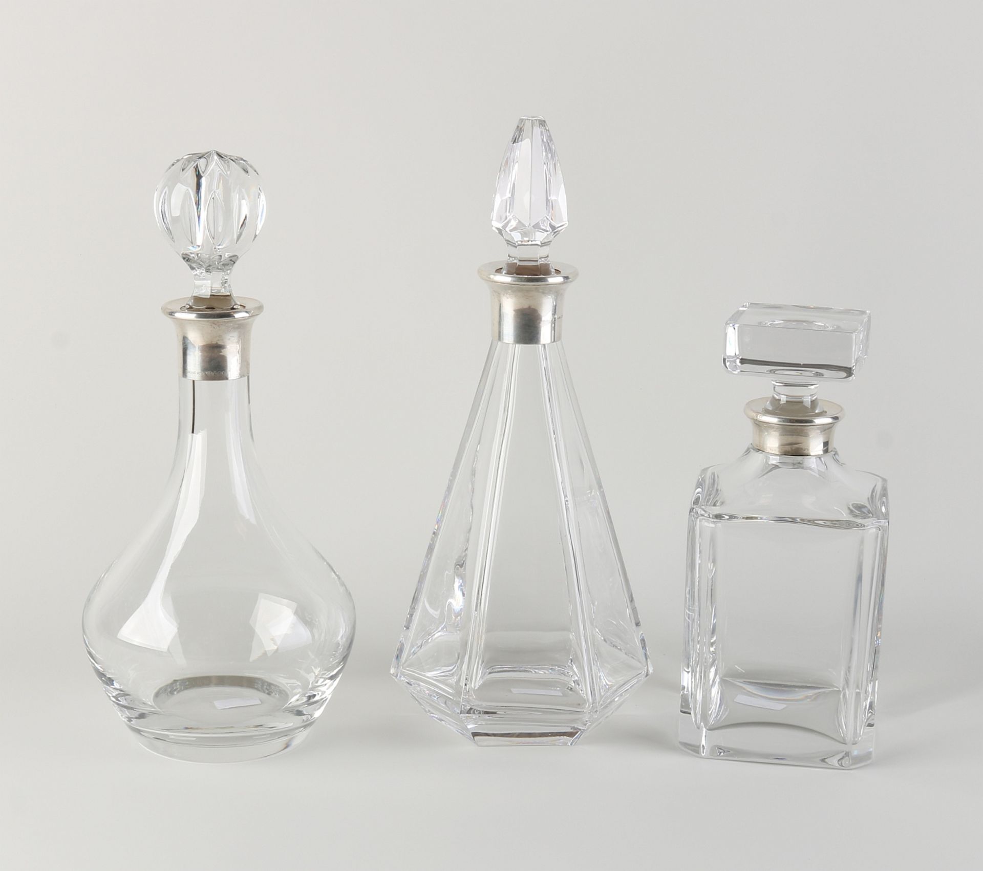 3 decanters with silver