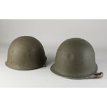 Two US army helmets