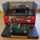 Three large die cast racing cars