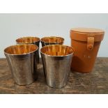 Four white metal Stirrup Cups with gilt interiors and fitted leather case