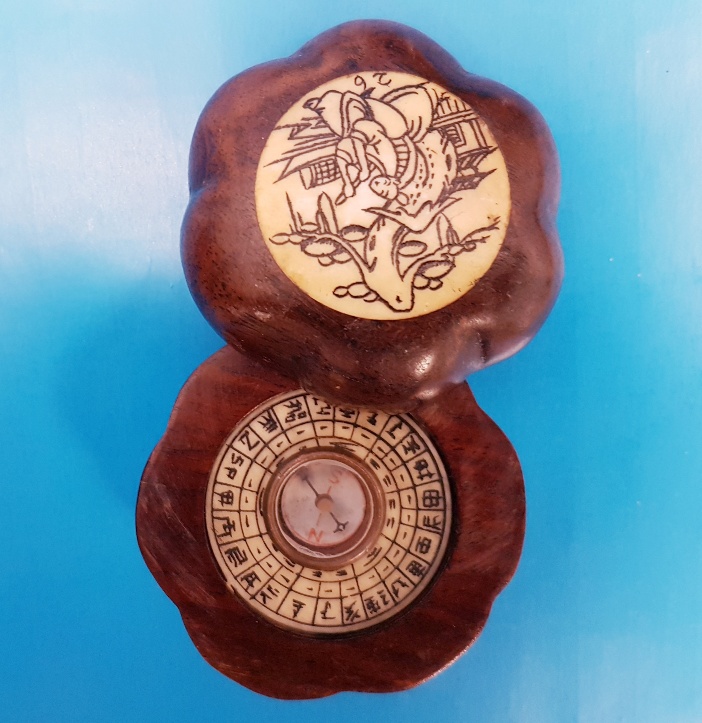 Small Chinese Compass in wood and bone surround, with slide opening