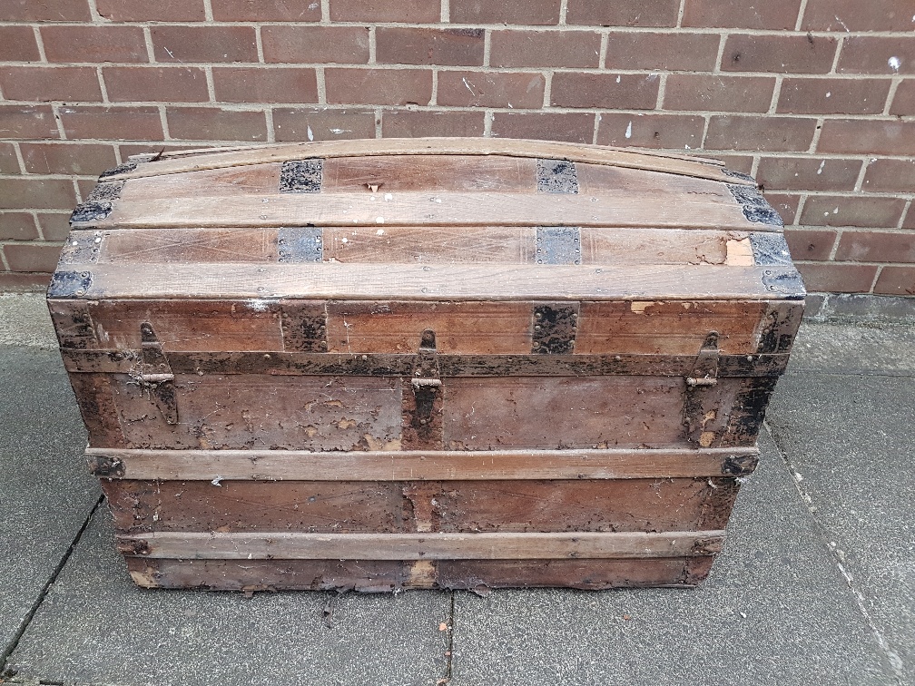 A large metal bound domed sea chest for refurbishment