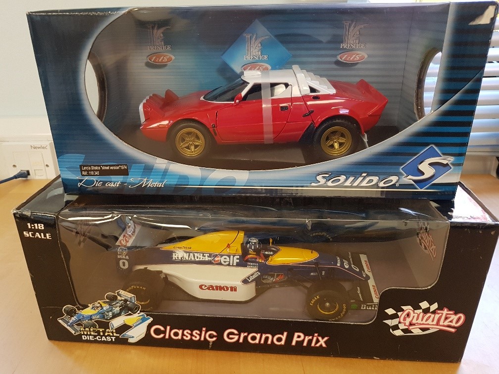 Two large boxed die cast racing cars
