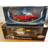 Two large boxed die cast racing cars