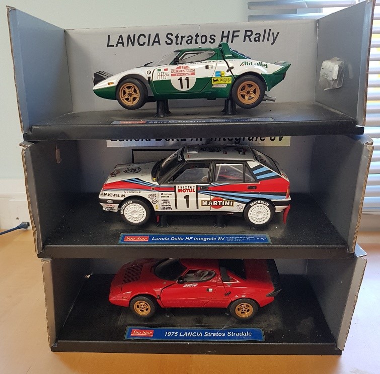 Three large die cast racing cars