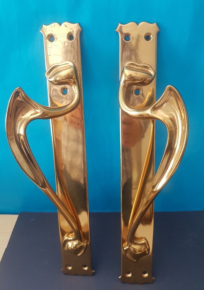 A pair of large brass Art Nouveau Door Handles