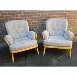 A pair of Ercol Beech and Elm Jubilee Armchairs with fitted cushions