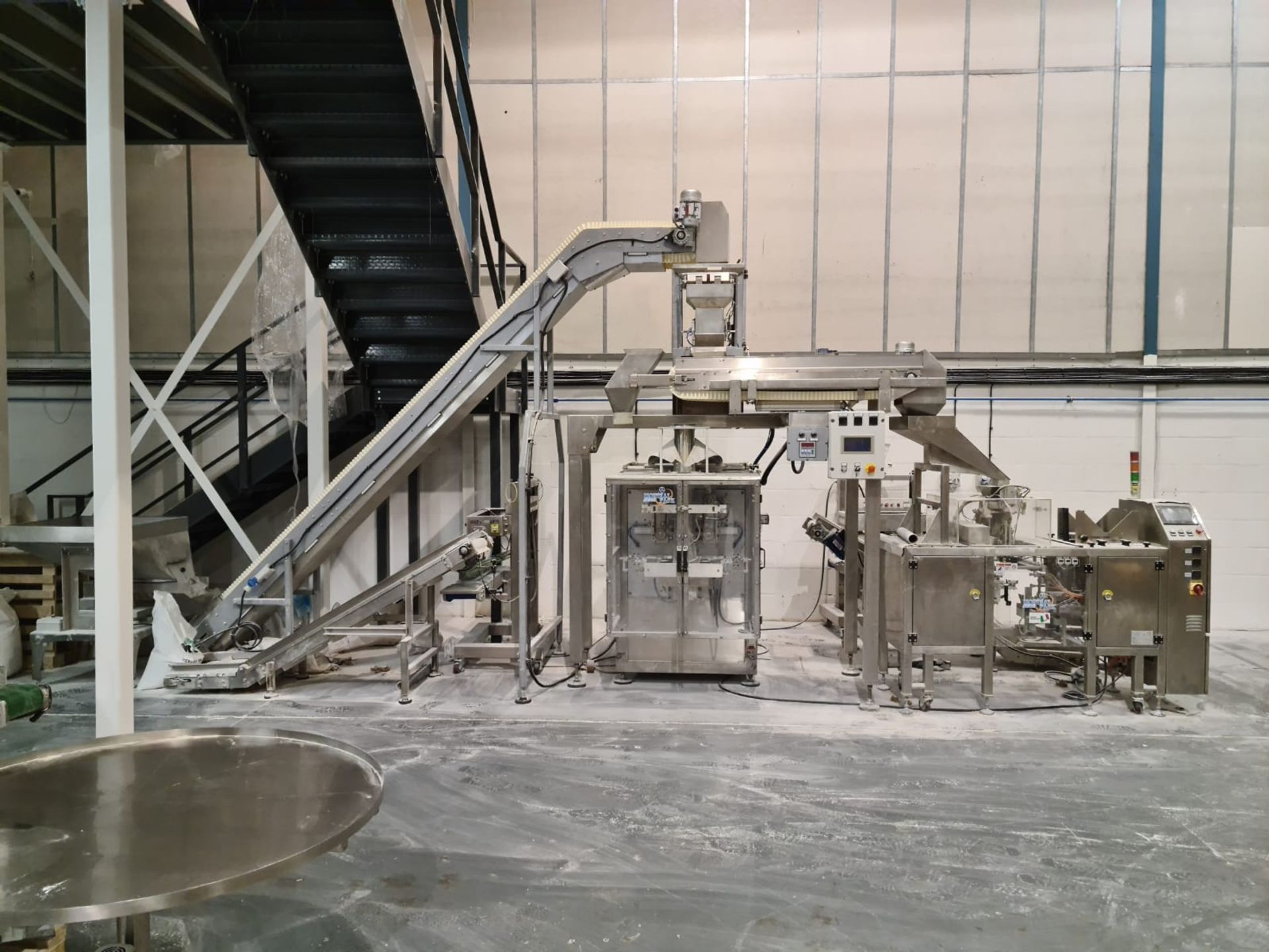 VERTICAL FORM FILL AND SEAL AND POUCH PACKING LINE