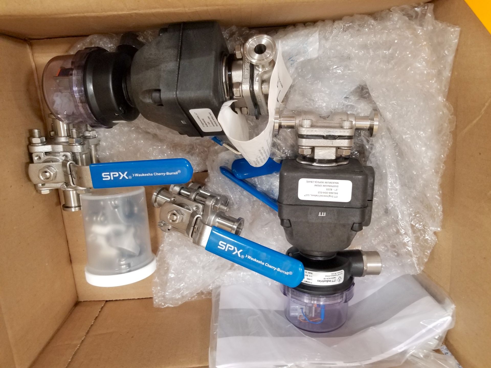 Box of SPX Hand Valves and ITT Engineered Electronic .5 Inch Valves