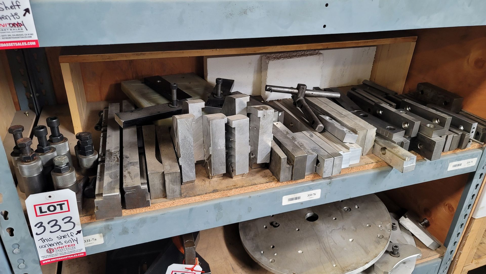 LOT - CONTENTS ONLY OF (1) 4' SHELF: ALUMINUM AND STEEL, VISE JAWS, ETC.