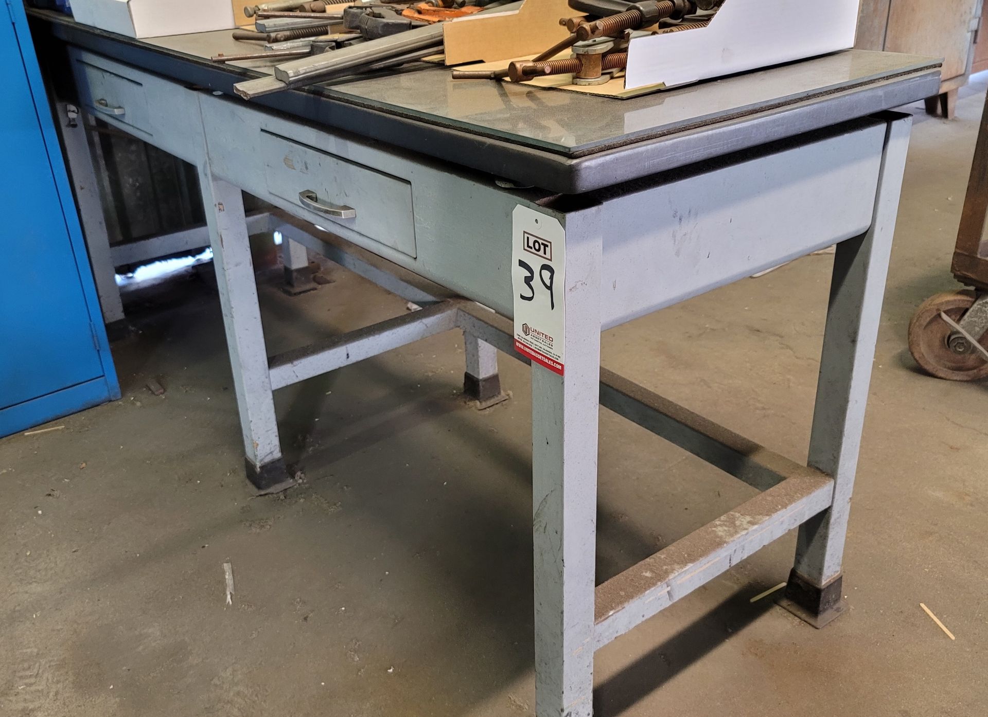 METAL WORK BENCH, 6' X 2' X 33" TALL, W/ GLASS TOP (LOCATION: BUILDING 39)