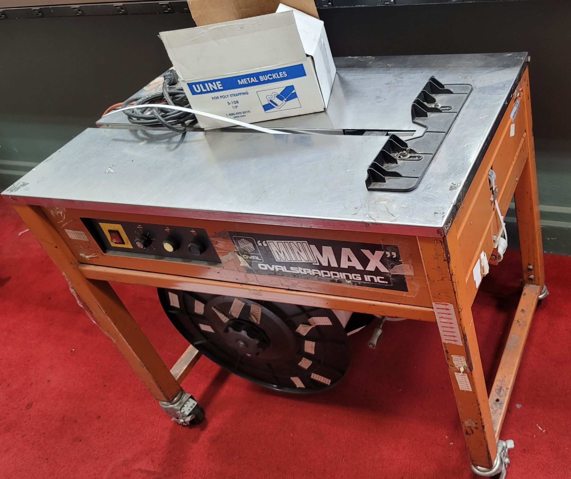 LOT - (1) OVAL STRAPPING INC MODEL MMAX MINI MAX STRAPPING MACHINE AND (1) LATTER PACKAGING MODEL