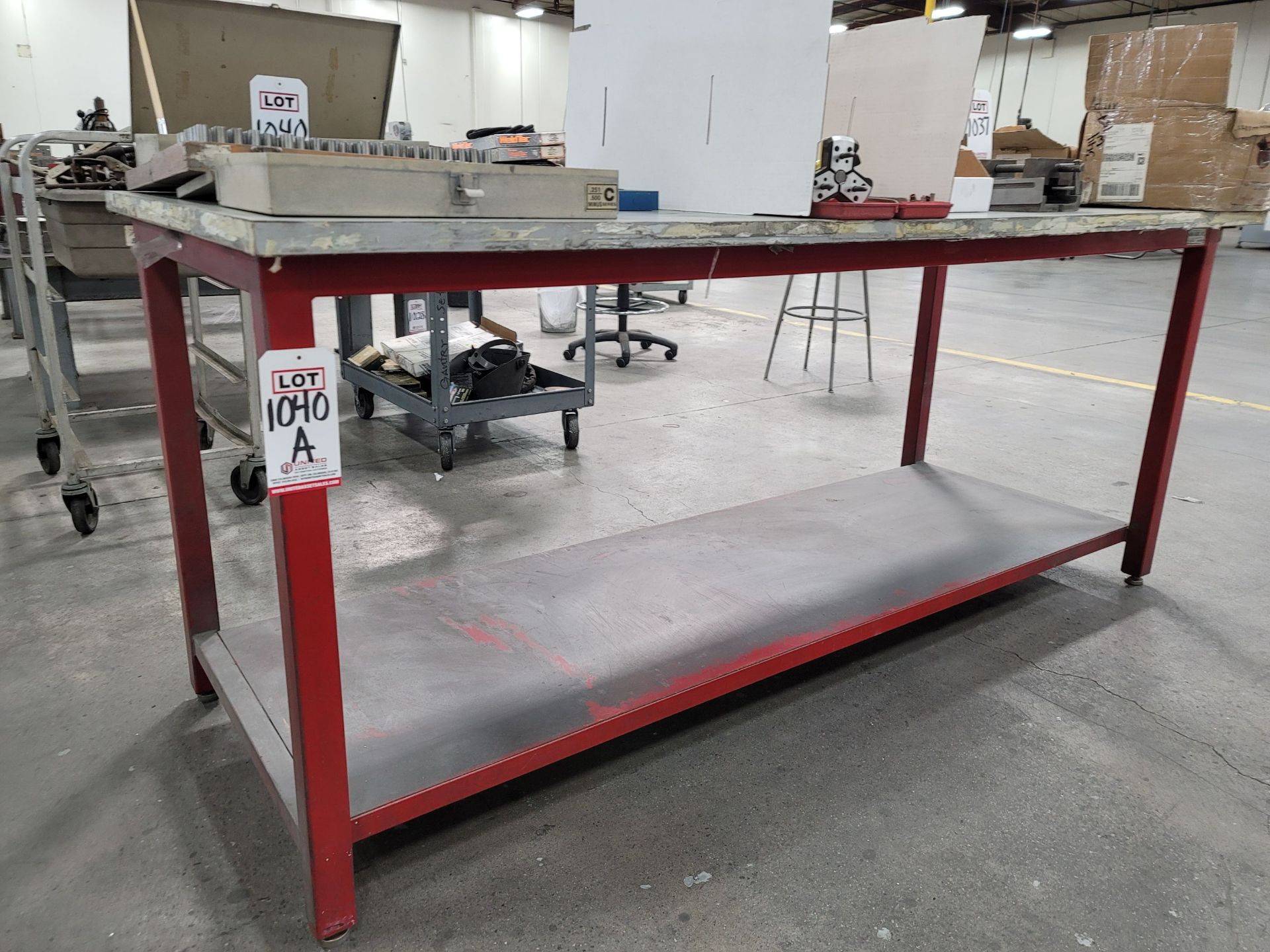 STEEL TABLE W/ 3' X 7' PARTICLE BOARD TOP