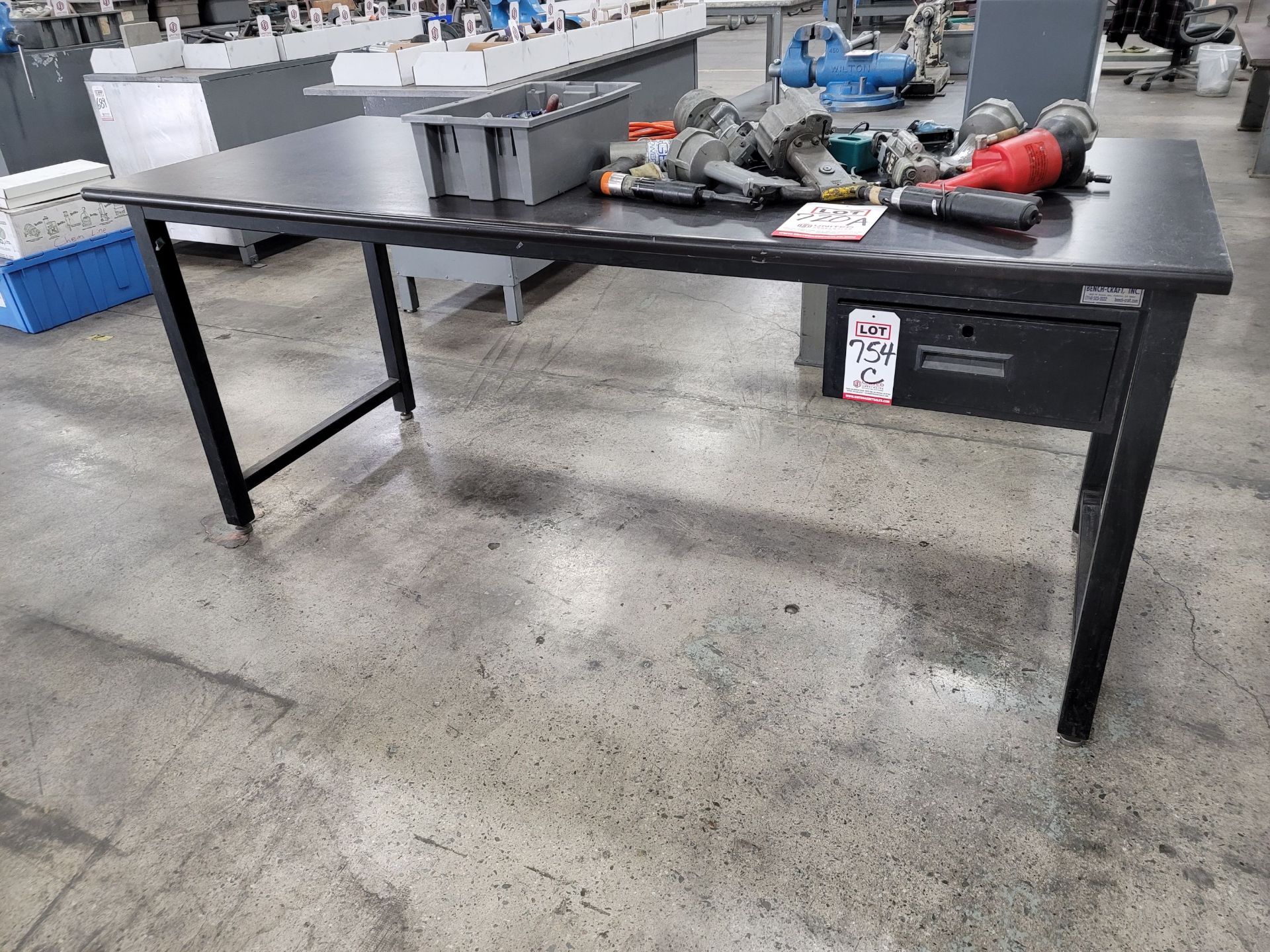 STEEL TABLE W/ 3' X 7' PARTICLE BOARD TOP, CONTENTS NOT INCLUDED