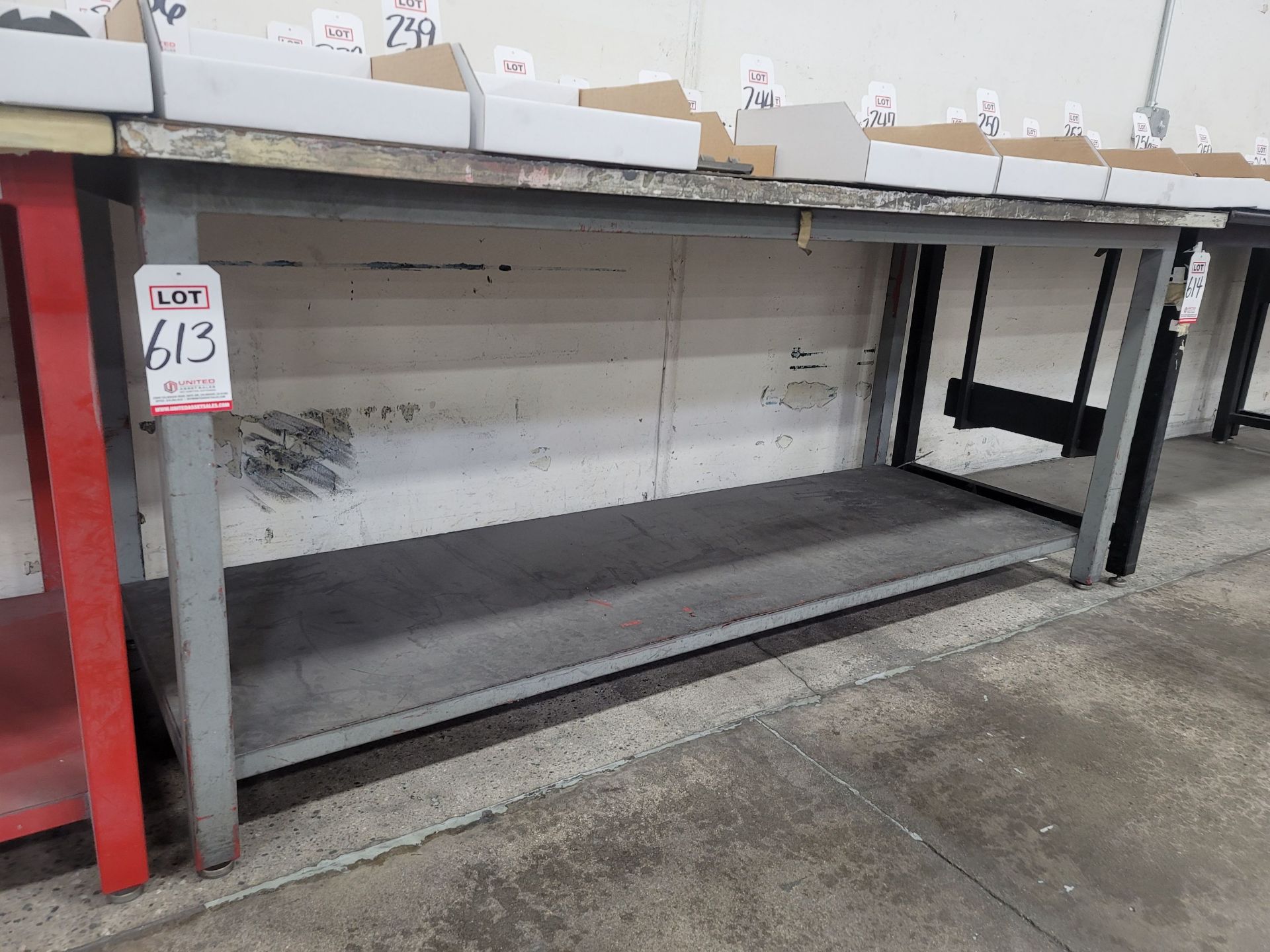 STEEL TABLE W/ 7' X 3' PARTICLE BOARD TOP, 36" HEIGHT, CONTENTS NOT INCLUDED