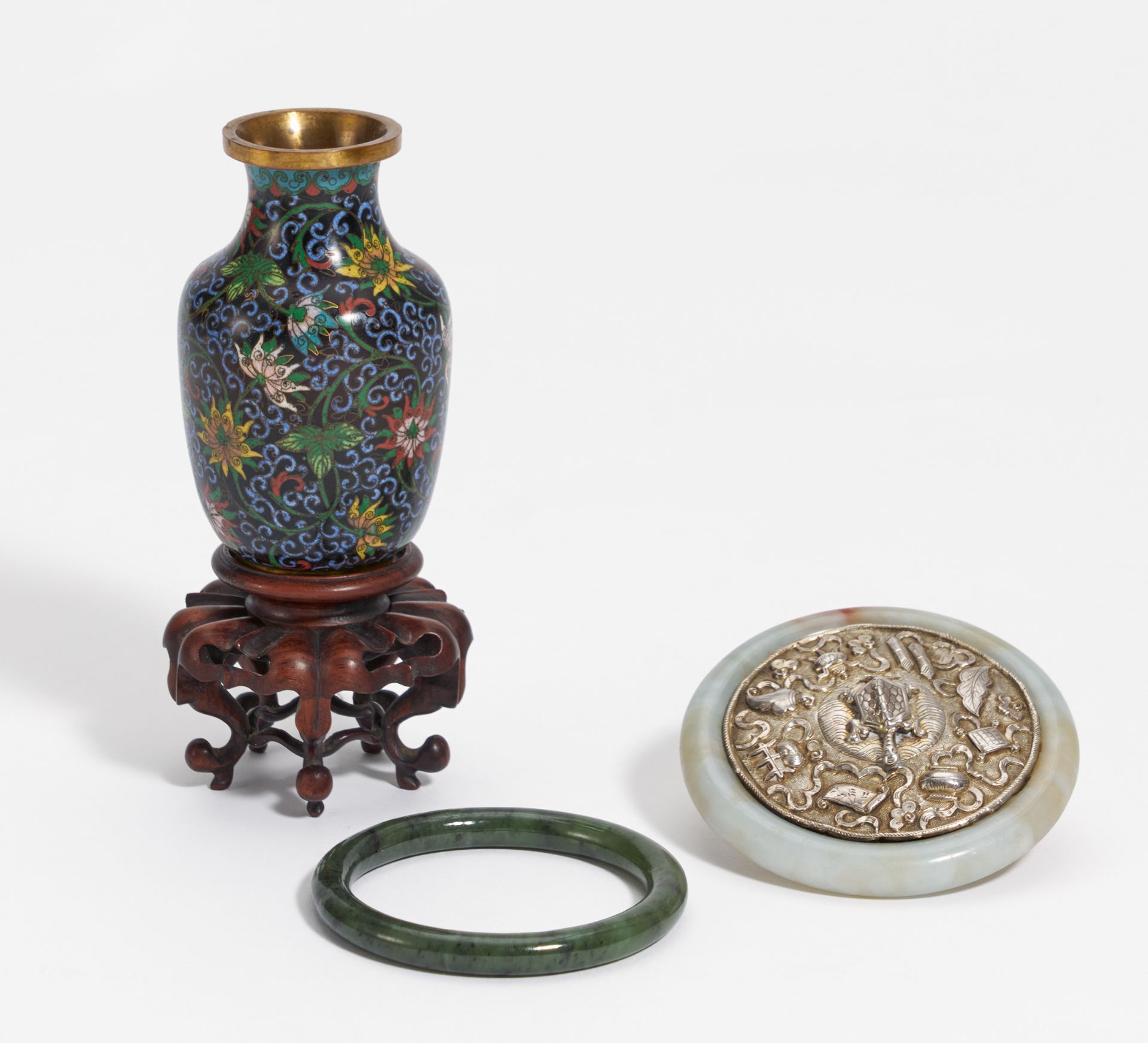 SMALL MIRROR, JADE ARM SPANGLE AND CLOISONNÉ VASE. China. 19th-20th c. a) Mirror with silver back