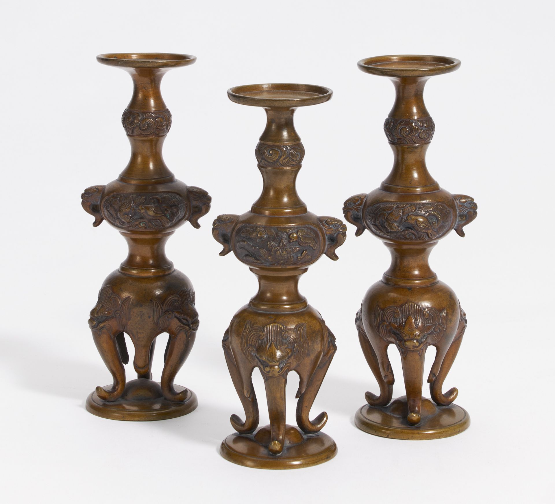 THE LAMPSTANDS WITH ELEPHANTS AND LIONS. Japan. Meiji period. Ca. 1900. Bronze with dark brown