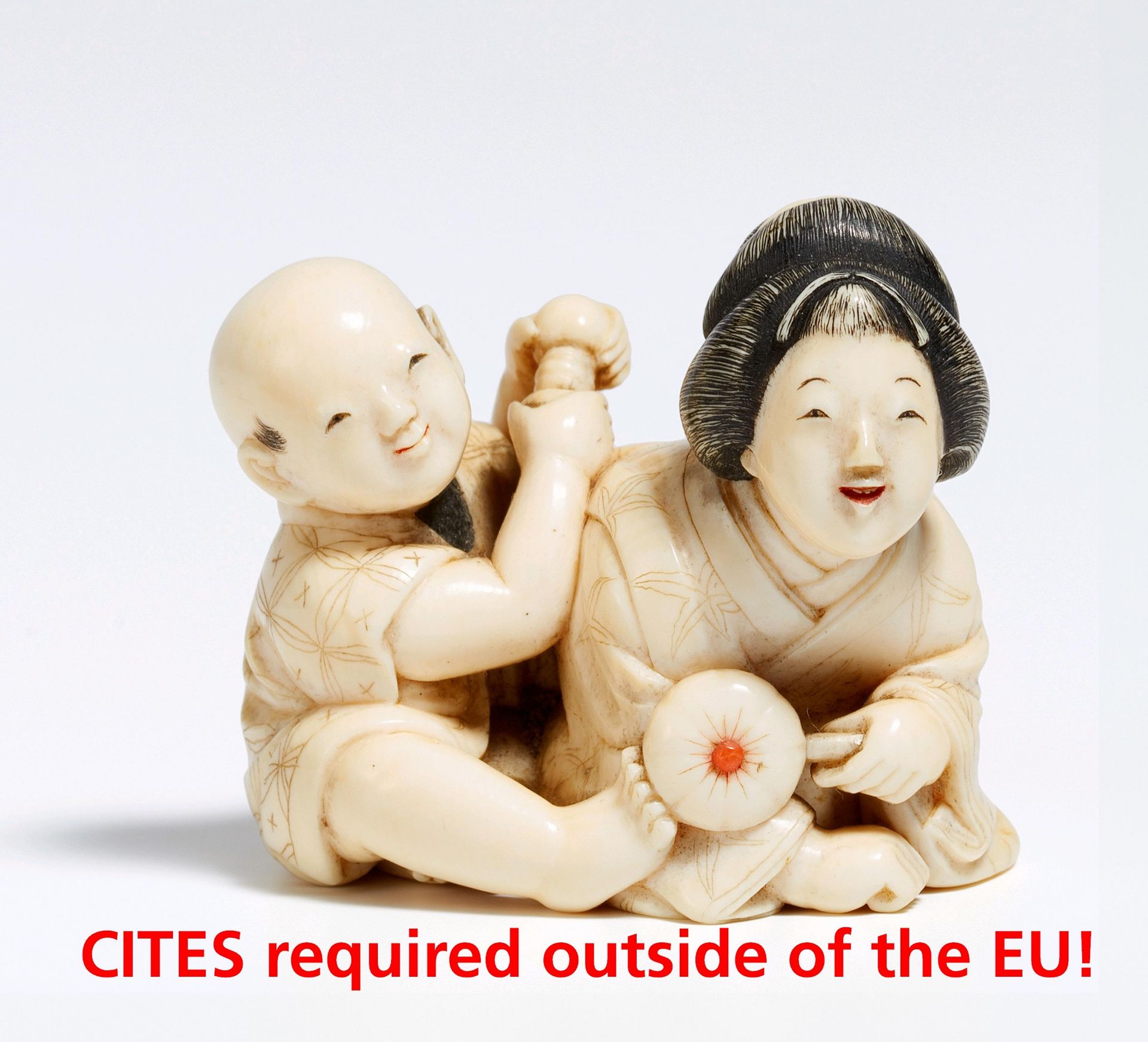 NETSUKE OF A MOTHER WITH HER SON. Japan. Early Meiji period (1868-1912). Ivory, carved and finely
