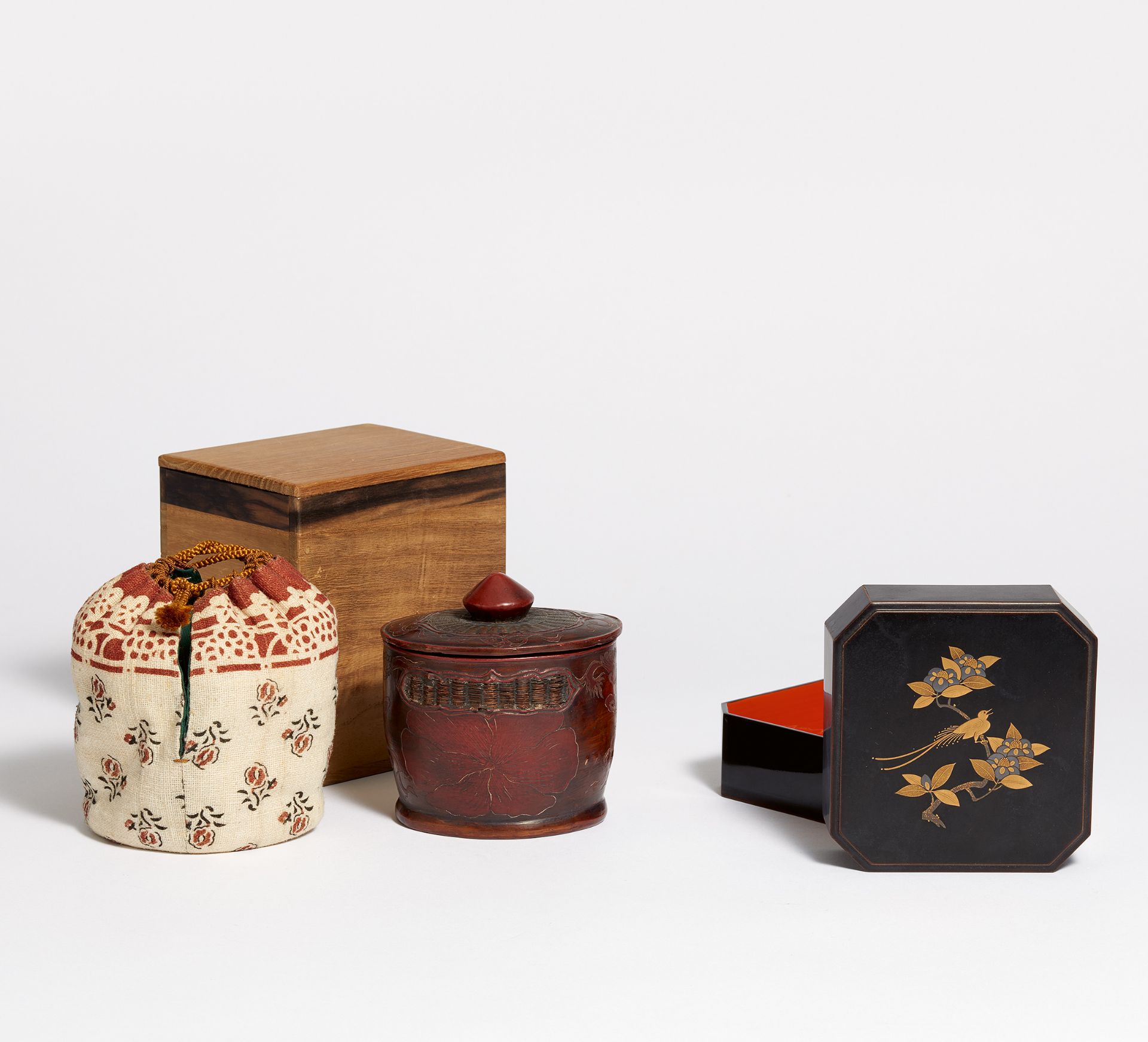 TWO LACQUER LIDDED BOXES. Japan. 19th c. a) Flat octagonal lacquer box with beveled corners. Wood