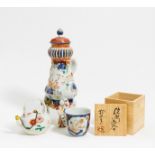 RARE COFFEE POT, TEA POT AND CUP. Japan. Edo period. Arita porcelain, partly with relief, painted in