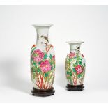 TWO VASES WITH CHINESE BULBULS IN SPLENDID PEONIES. China. Beg. 20th c. Porcelain famille rose.