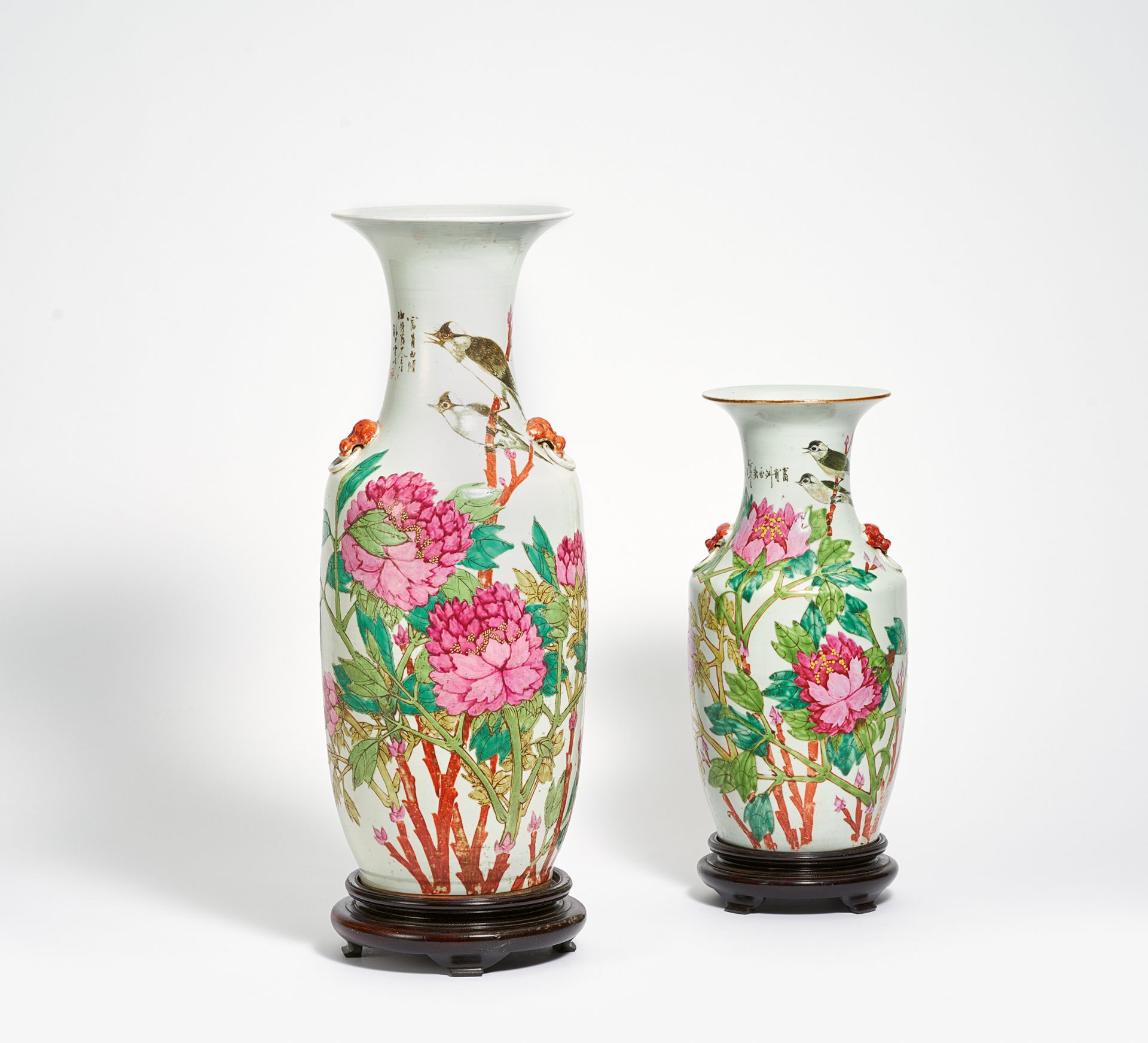 TWO VASES WITH CHINESE BULBULS IN SPLENDID PEONIES. China. Beg. 20th c. Porcelain famille rose.
