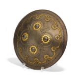 IMPORTANT SHIELD (DHAL/SEPAR) WITH KNOBS AND SCROLLS. Mughal India/Persia. 18th/19th c. Iron with