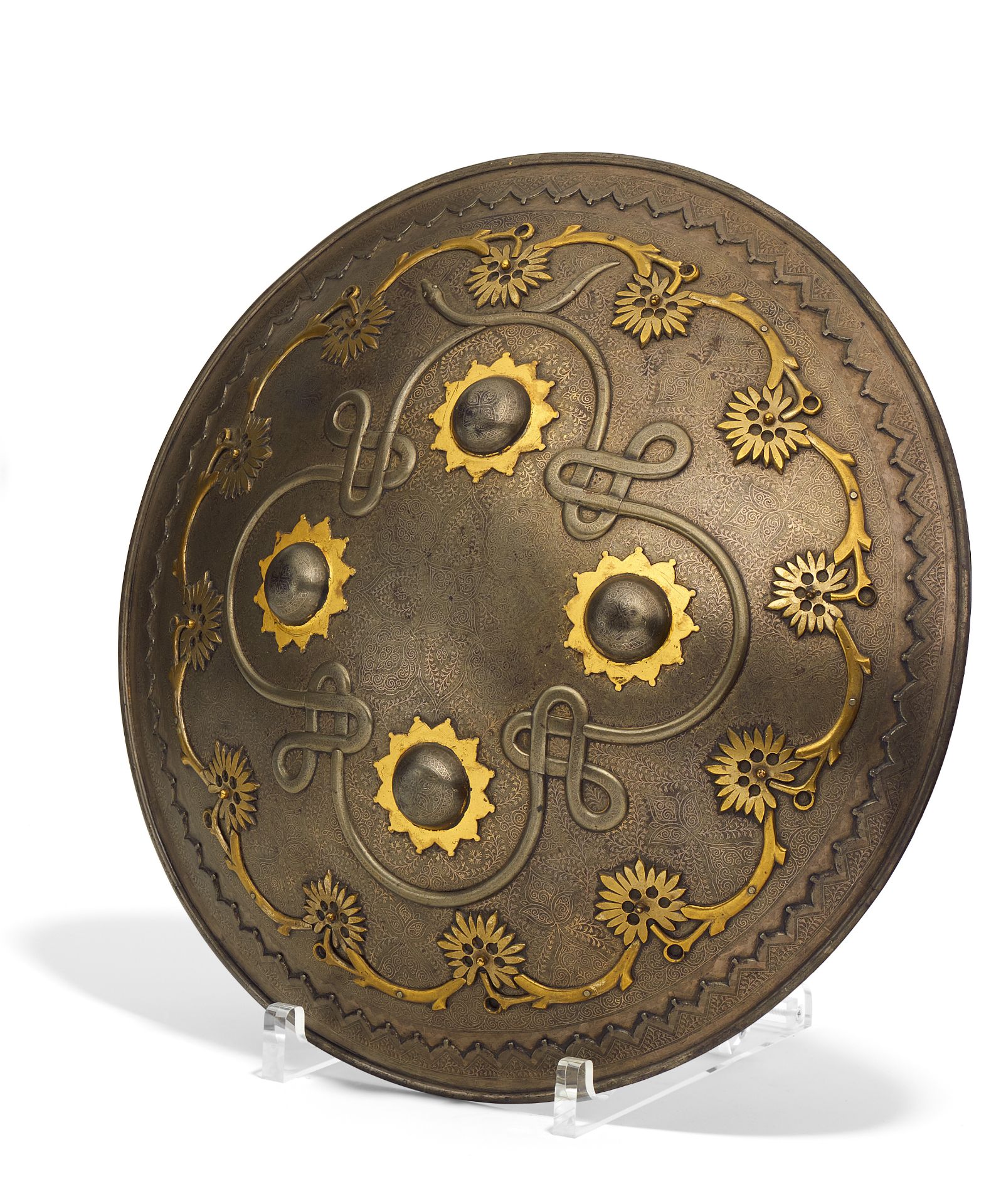 IMPORTANT SHIELD (DHAL/SEPAR) WITH KNOBS AND SCROLLS. Mughal India/Persia. 18th/19th c. Iron with