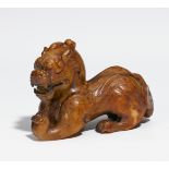 RARE CROUCHING BIXIE. China. Detailed carved from light jade with dark brown skin. The