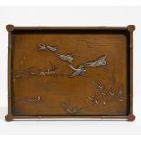 TRAY WITH CRANES, FLYING UP FROM A LAKESIDE. Japan. Meiji period (1868-1912). Bronze (sentoku)
