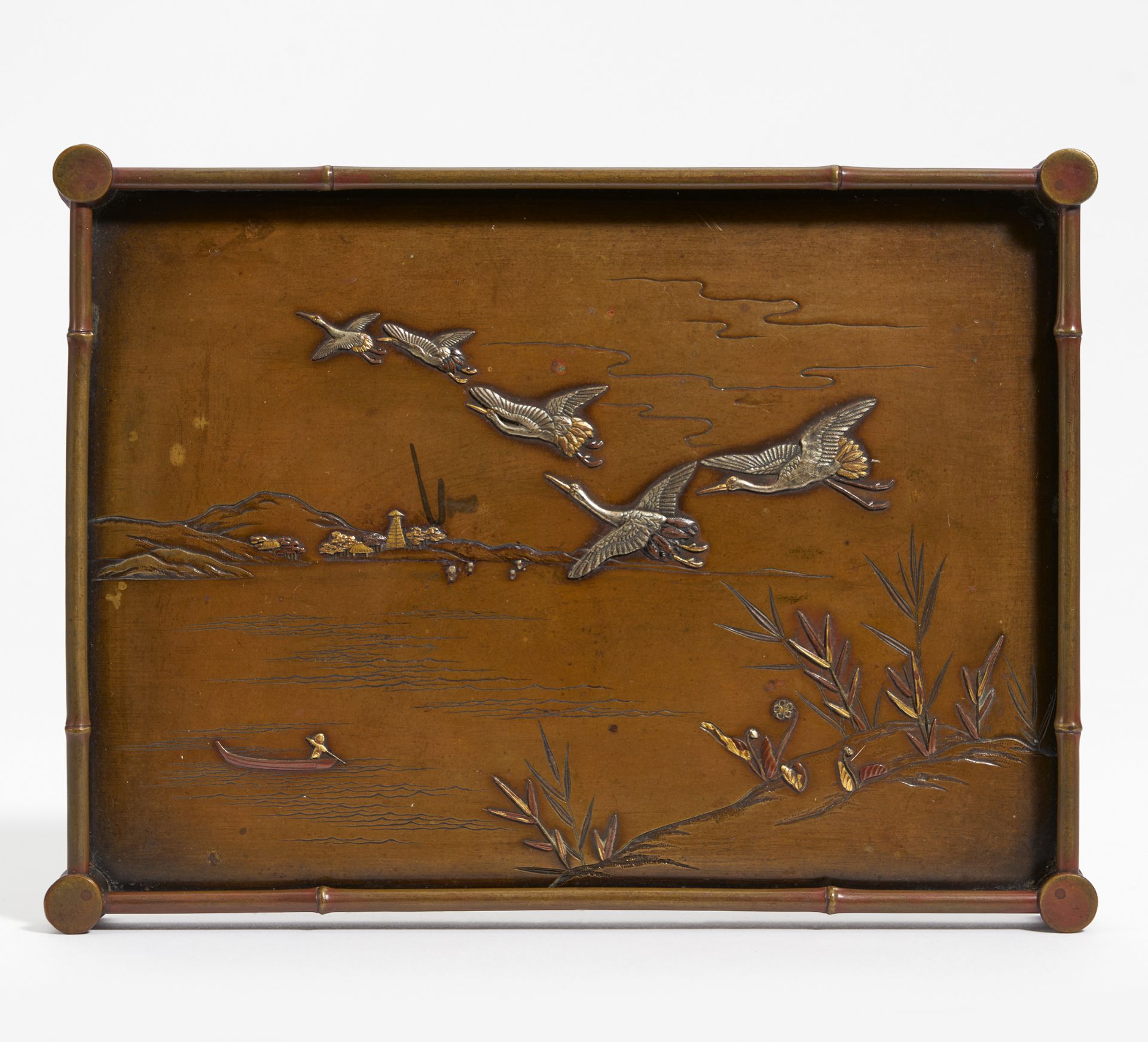 TRAY WITH CRANES, FLYING UP FROM A LAKESIDE. Japan. Meiji period (1868-1912). Bronze (sentoku)