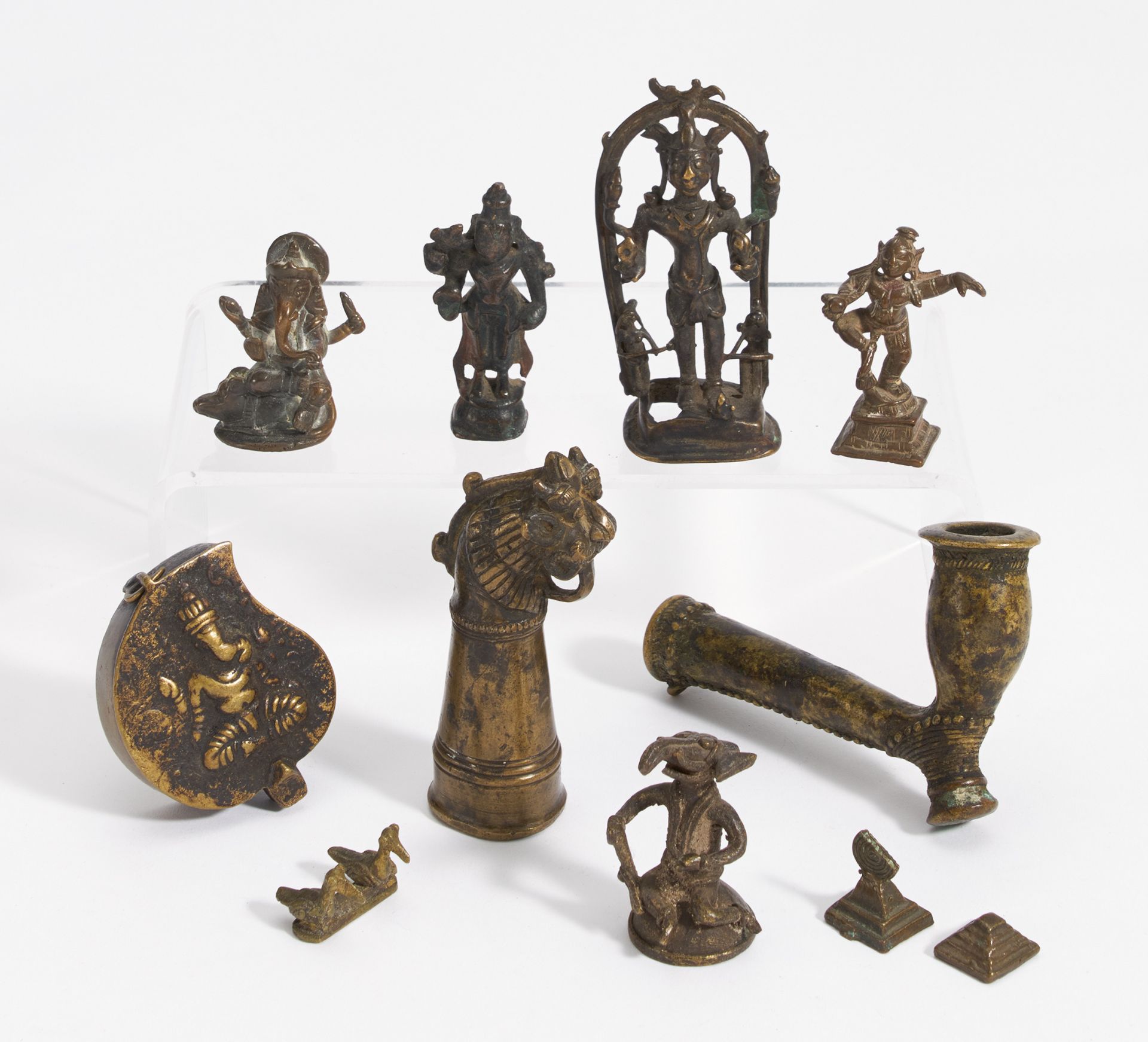 ELEVEN FIGURES, A PIPE AND SMALL BOX. India. 18th-20th c. Bronze with dark patina. a) Shiva with