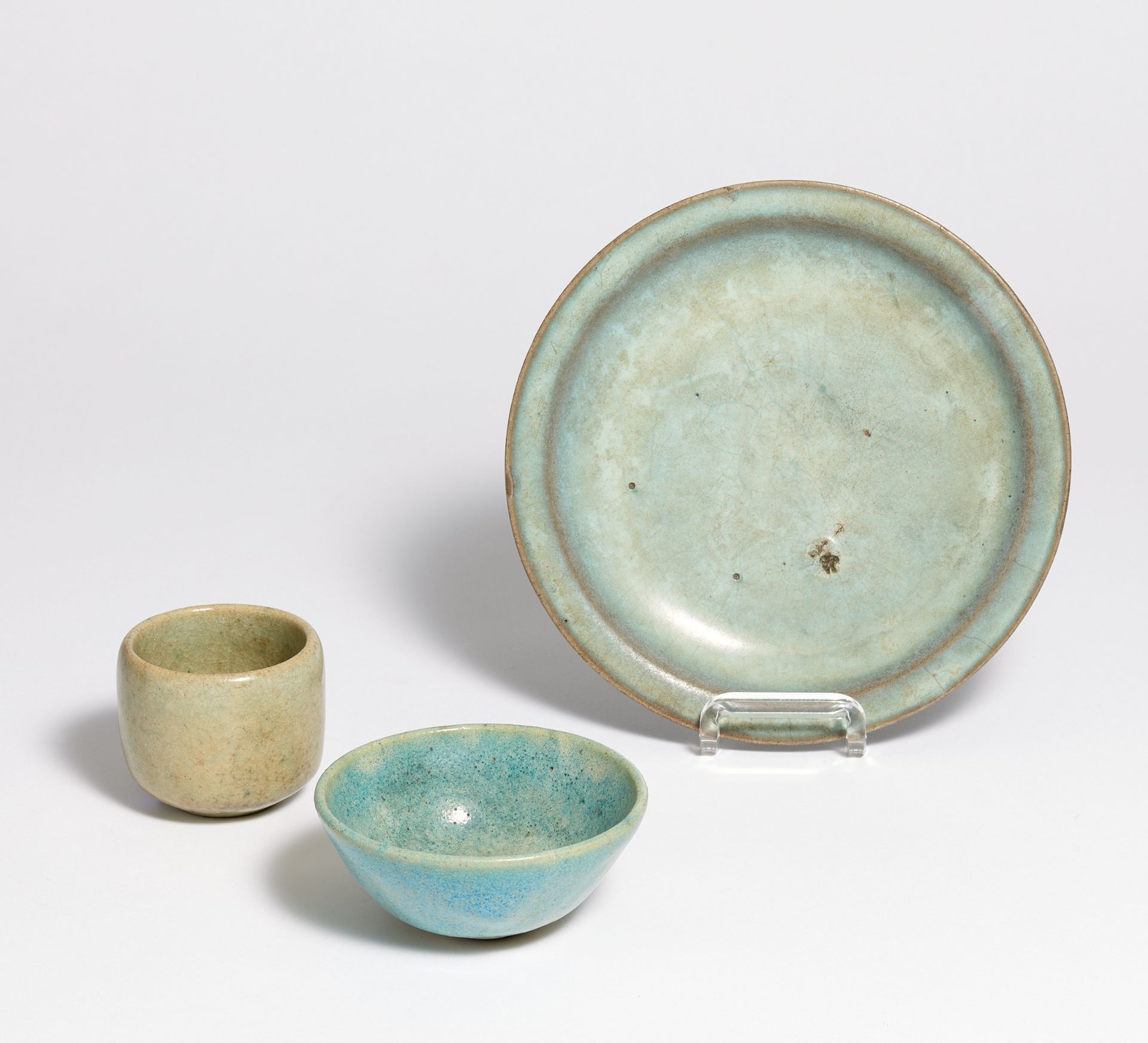 DISH AND CUP WITH JUNYAO GLAZE. China. Song or Ming dynasty. Light grey stoneware, covered with