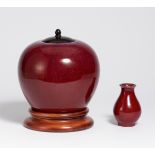 BULBOUS JAR AND SMALL VASE IN OX BLOOD RED. China. 19th c. Porcelain with ox blood red flambé glaze.