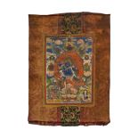 THANGKA WITH MAHAKALA. Tibet/Nepal. 19th-20th c. Pigments on fabric. Mounted with printed