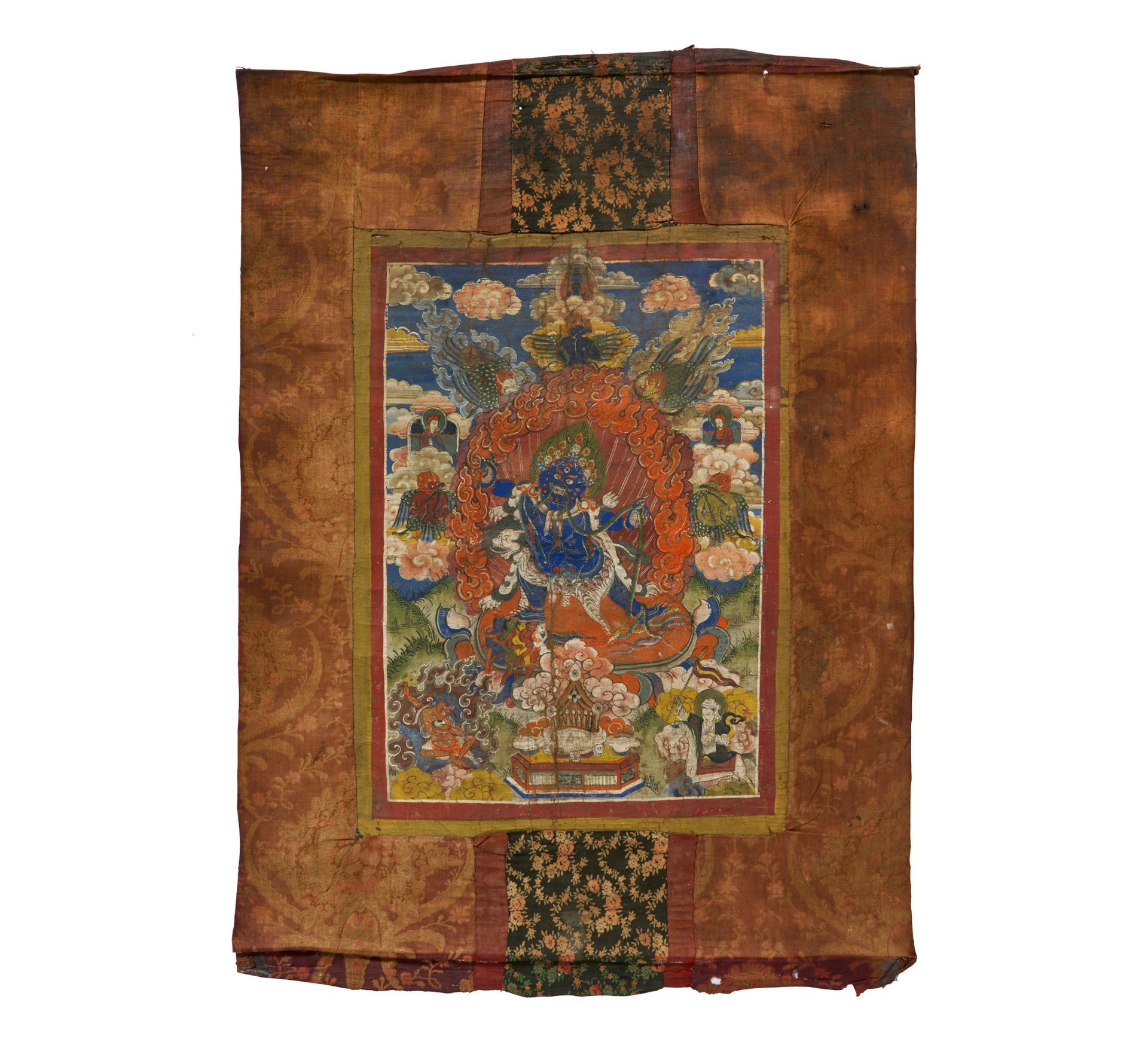 THANGKA WITH MAHAKALA. Tibet/Nepal. 19th-20th c. Pigments on fabric. Mounted with printed