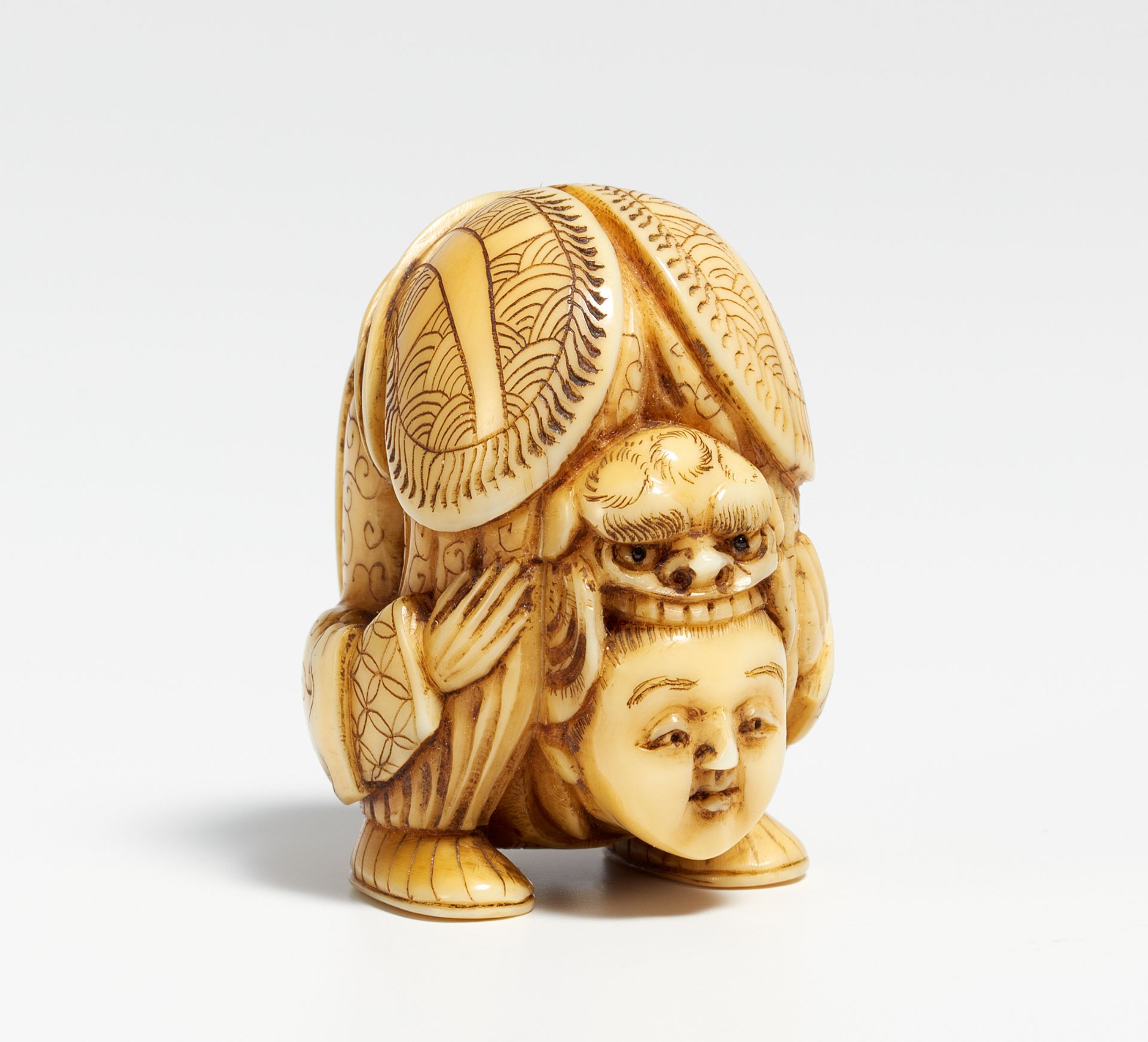 NETSUKE OF A CHINESE ACROBAT. Japan. 19th c. Ivory, carved and engraved, buttons inlaid in dark - Bild 2 aus 2