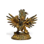 WINGED HERUKA WITH HIS CONSORT IN YAB-YUM. Tibet/Nepal. 19th/20th c. Copper bronze with fire