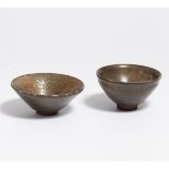TWO TENMOKU TEA BOWLS. Japan. 18th-19th c. Dark brown, highly fired stoneware, covered with dark