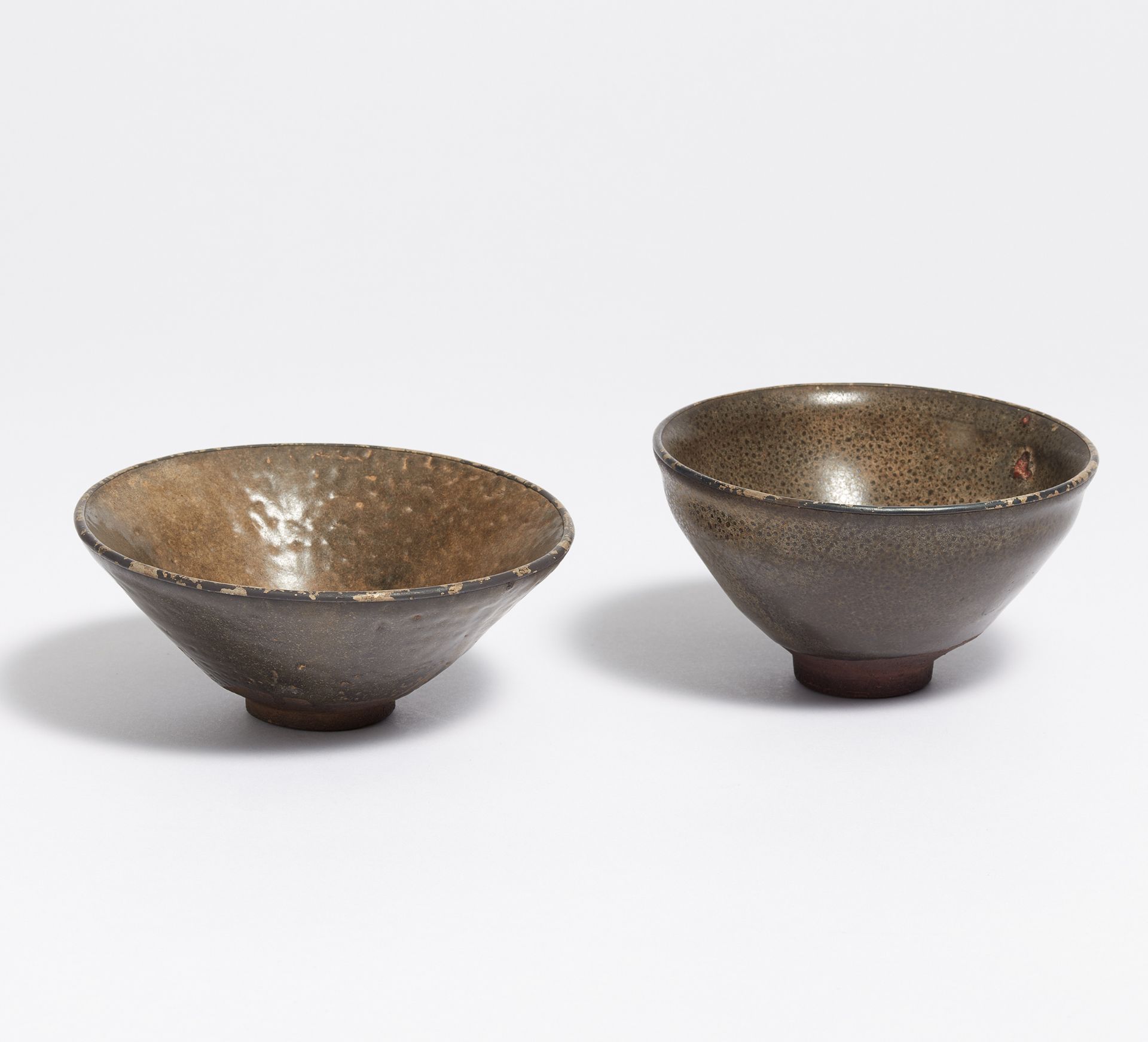 TWO TENMOKU TEA BOWLS. Japan. 18th-19th c. Dark brown, highly fired stoneware, covered with dark