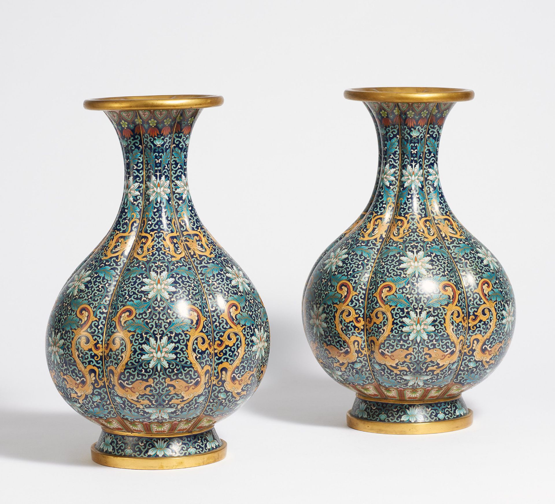 PAIR OF SIX-PASS VASES WITH DRAGONS AND DENSE LOTUS TENDRILS. China. 20th c. Copper with cloisonné