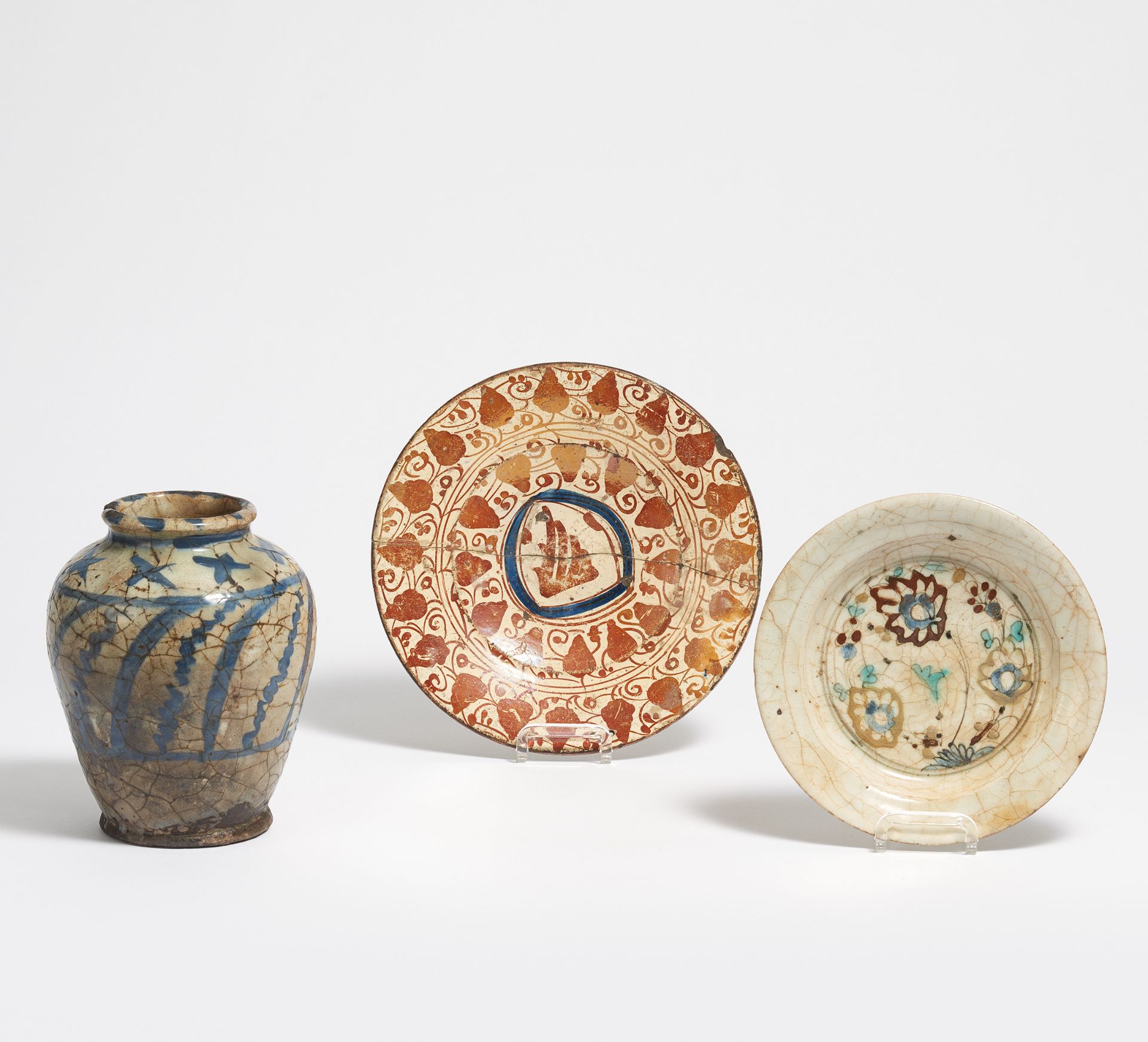 TWO DISHES AND A VASE. Persia. Safawid dynasty (1501-1722). Stonepaste painted, glaze partly with