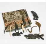 NINE ARTIFACTS. Indonesia. Sumatra. Batak. Early 20th c. Buffalo horn, bone, wood, iron. a) Comb.